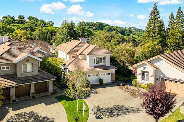 2909 Quail Hollow Dr, Fairfield, CA 94534 - view of front of home with a tile roof, concrete driveway, a garage, and stucco siding