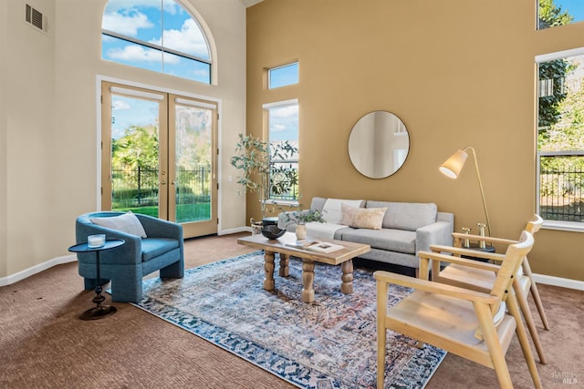 2909 Quail Hollow Dr, Fairfield, CA 94534 - carpeted living area featuring baseboards, visible vents, french doors, and a towering ceiling