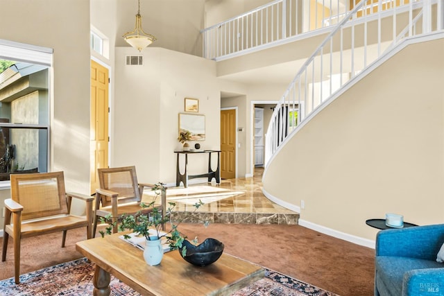 2909 Quail Hollow Dr, Fairfield, CA 94534 - carpeted living room with stairway, a high ceiling, baseboards, and visible vents