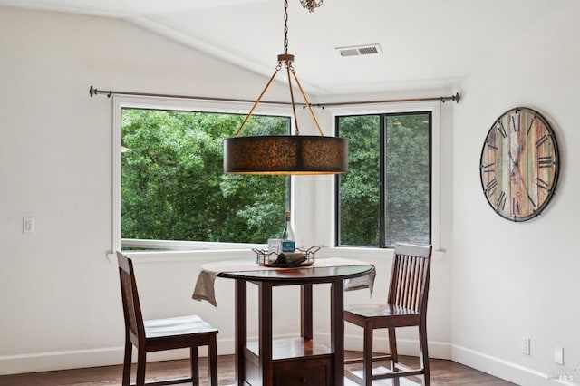 dining area with a healthy amount of sunlight and wood finished floors