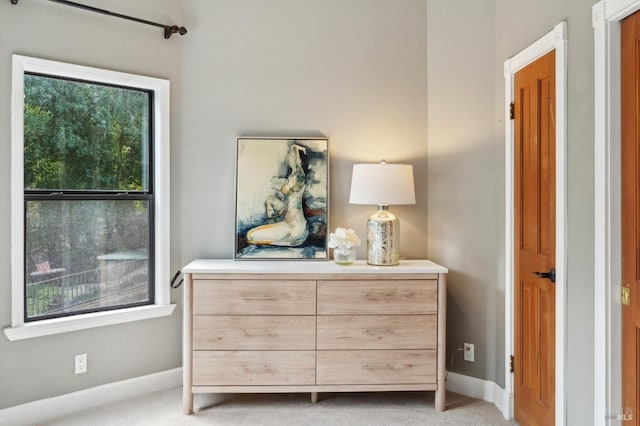 bedroom with carpet flooring and baseboards