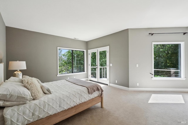 bedroom featuring baseboards, visible vents, carpet, and access to outside
