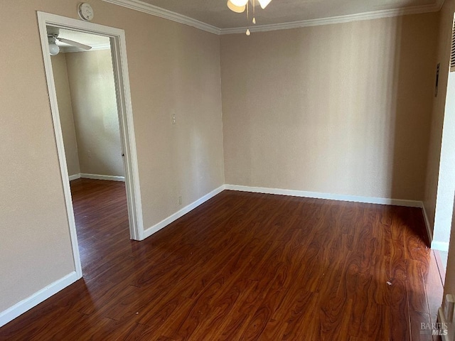 empty room with dark wood-type flooring, ceiling fan, baseboards, and crown molding