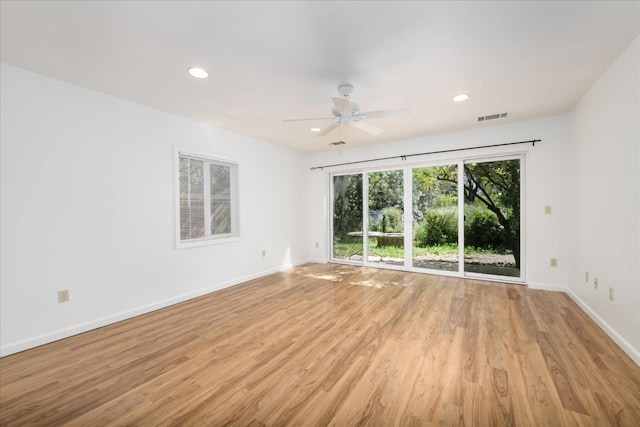 unfurnished room with visible vents, ceiling fan, light wood-type flooring, and recessed lighting