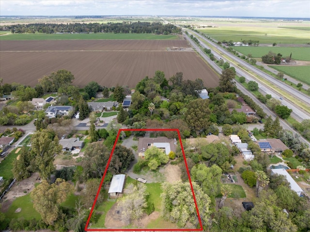 birds eye view of property featuring a residential view and a rural view