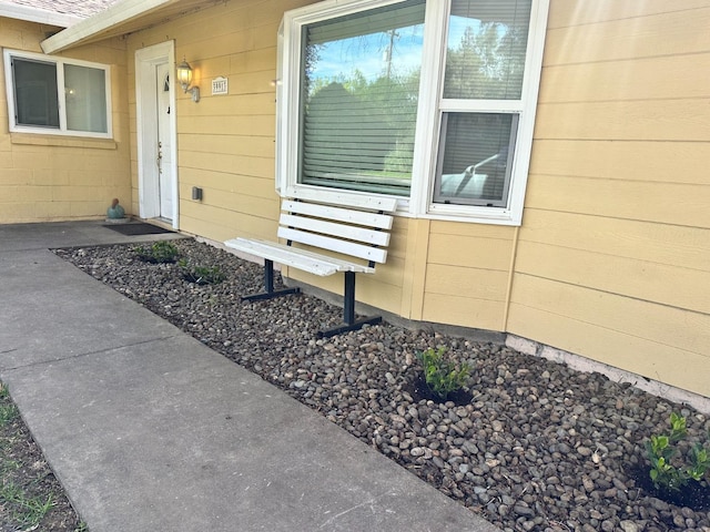 view of exterior entry with concrete block siding