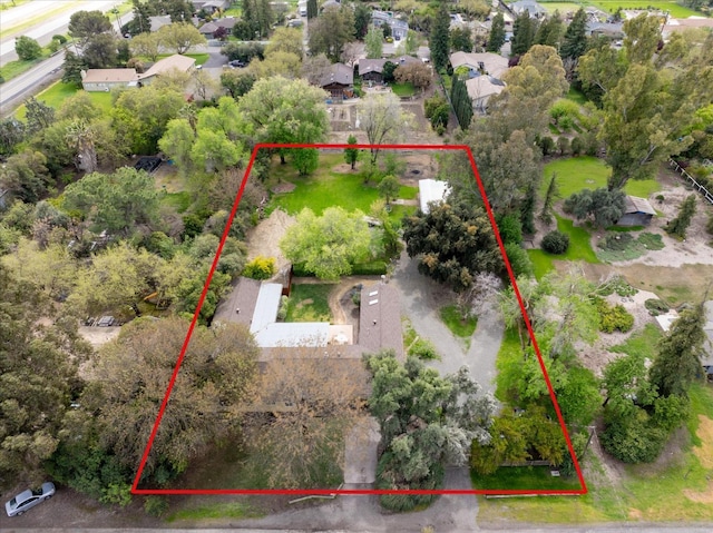 birds eye view of property with a residential view
