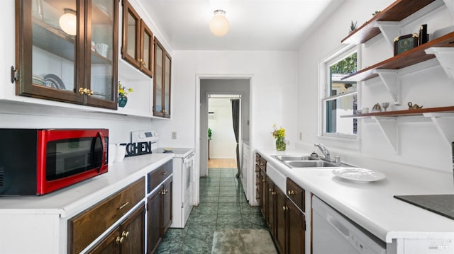kitchen featuring a sink, light countertops, open shelves, and white appliances