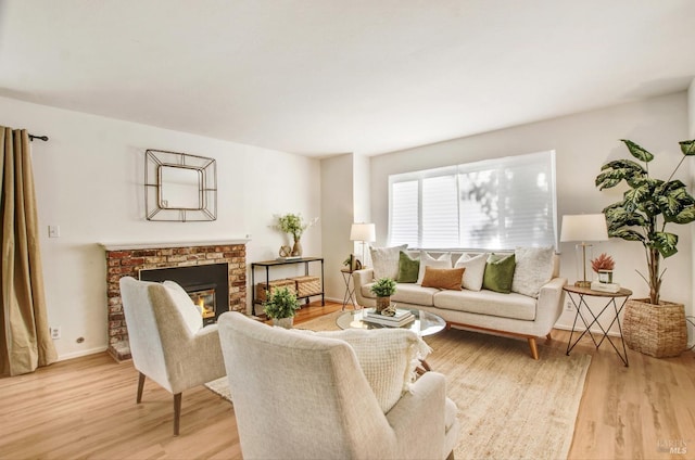 361 Neva St, Sebastopol, CA 95472 - living area with baseboards, a fireplace, and light wood finished floors