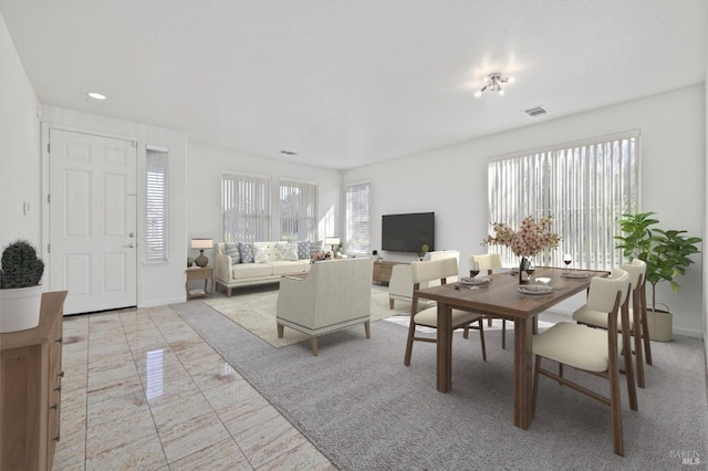 dining area featuring baseboards and visible vents