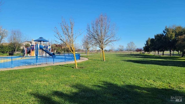 communal playground with a lawn