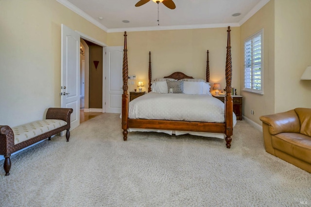 carpeted bedroom with baseboards, a ceiling fan, and crown molding