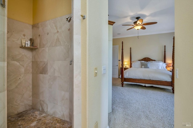 bedroom with carpet floors, ornamental molding, and ceiling fan