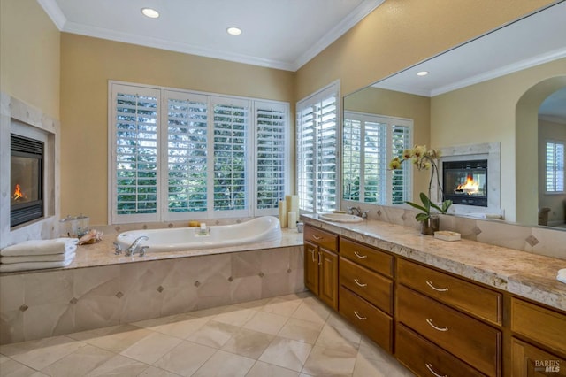 full bathroom featuring a bath, crown molding, tile patterned flooring, and a premium fireplace