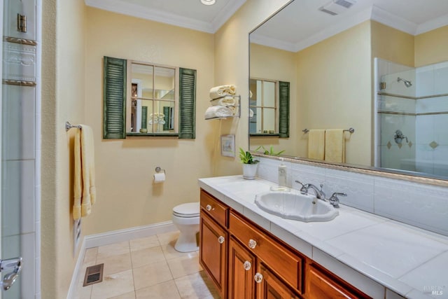 full bathroom with crown molding, toilet, a shower with door, baseboards, and visible vents