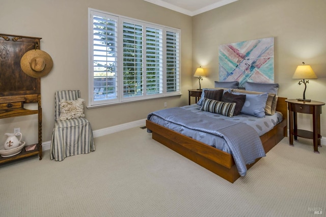 carpeted bedroom featuring baseboards and ornamental molding