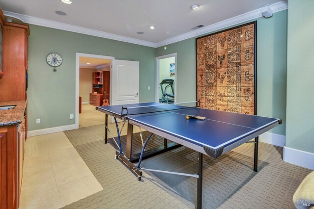 recreation room with baseboards, recessed lighting, and ornamental molding