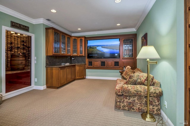 interior space featuring baseboards, recessed lighting, crown molding, and light colored carpet