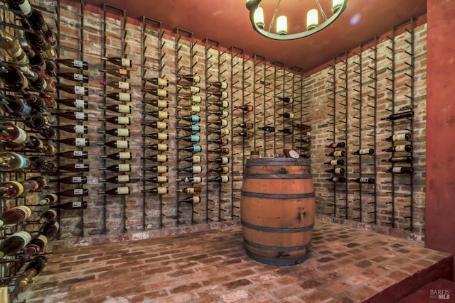 wine cellar featuring brick floor