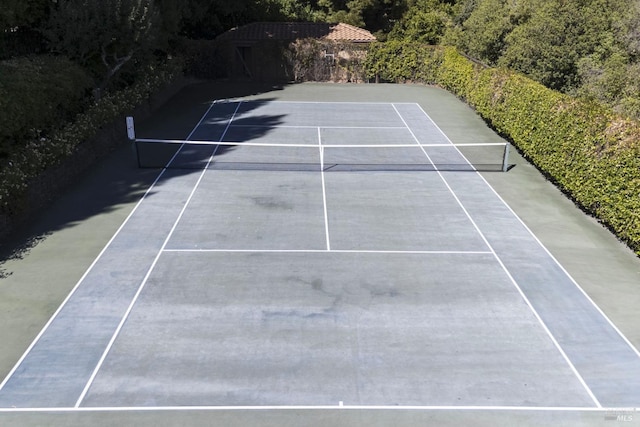 view of tennis court with fence