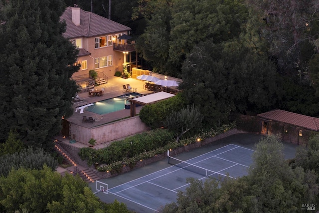 drone / aerial view featuring a view of trees