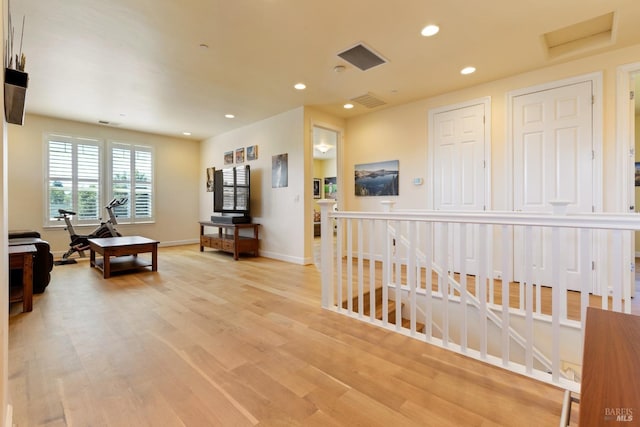 interior space featuring recessed lighting, baseboards, visible vents, and light wood-style flooring