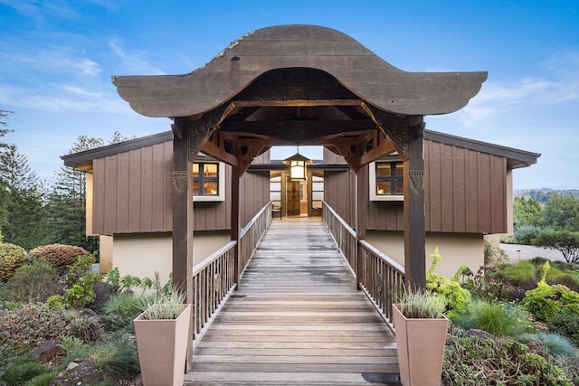 entrance to property with stucco siding