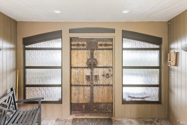 interior space featuring wooden walls