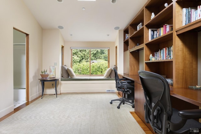 office featuring baseboards and visible vents