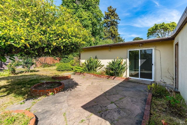 view of yard featuring a patio and fence