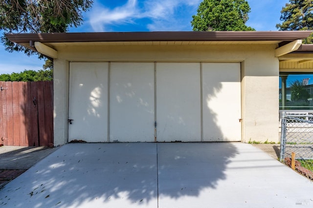 garage featuring fence