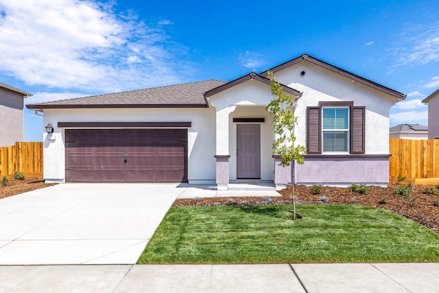 single story home with concrete driveway, stucco siding, fence, and an attached garage