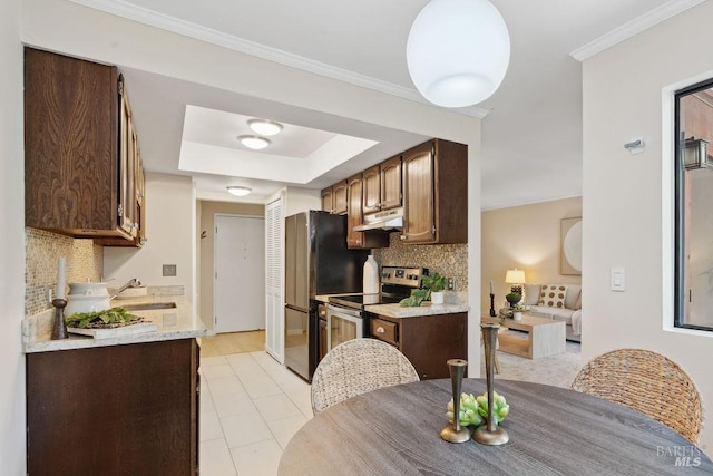 kitchen featuring crown molding, a sink, tasteful backsplash, stainless steel range with electric stovetop, and under cabinet range hood