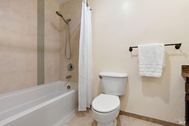 bathroom featuring shower / bath combo, baseboards, toilet, and tile patterned flooring