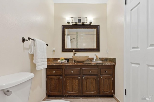 full bath featuring toilet, vanity, and curtained shower