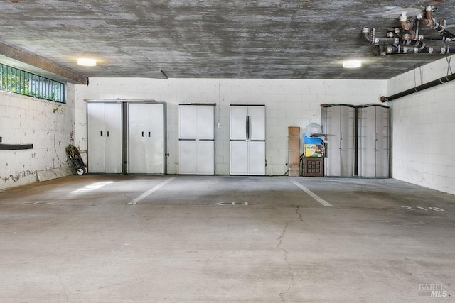 garage with concrete block wall