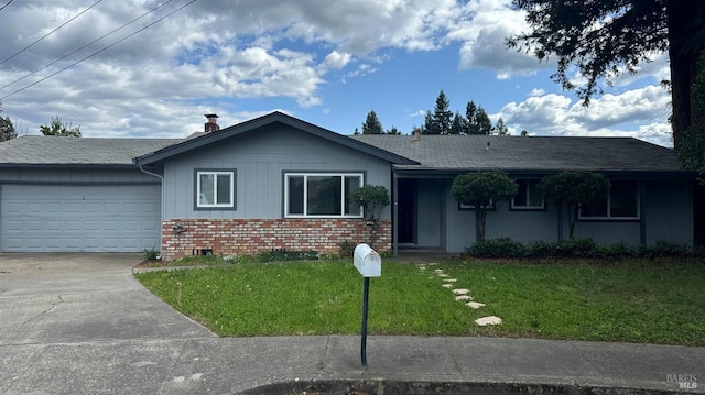 175 Nehoc Ct, Ukiah, CA 95482 - ranch-style house with a front lawn, an attached garage, brick siding, and concrete driveway
