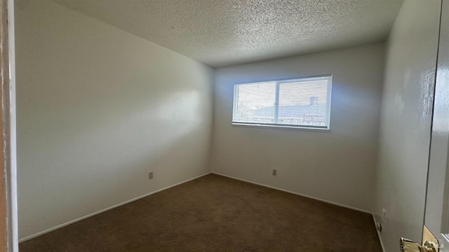 175 Nehoc Ct, Ukiah, CA 95482 - empty room with baseboards, dark colored carpet, and a textured ceiling