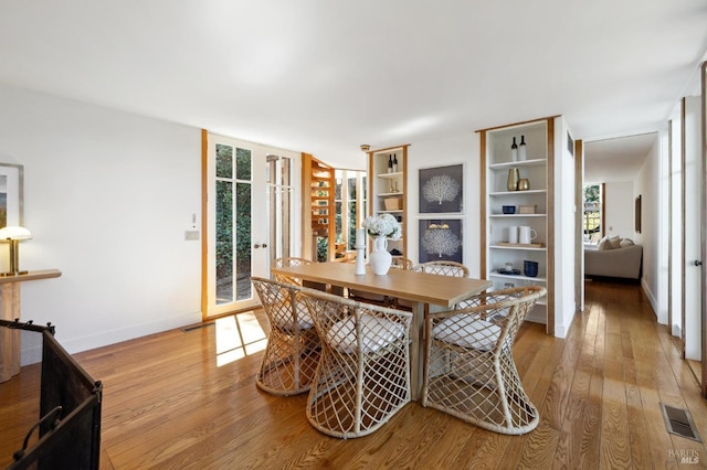 45 Bella Vista Ave, Belvedere, CA 94920 - dining room featuring baseboards, light wood-style floors, and visible vents