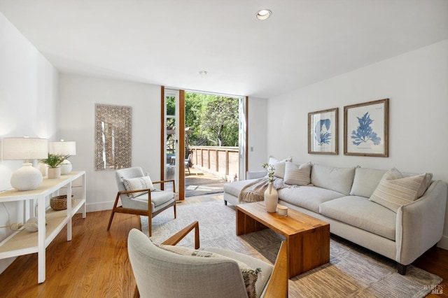 45 Bella Vista Ave, Belvedere, CA 94920 - living area with baseboards, recessed lighting, a wall of windows, and light wood finished floors