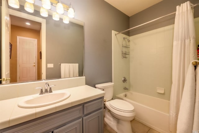 full bathroom featuring tile patterned floors, toilet, shower / tub combo with curtain, and vanity