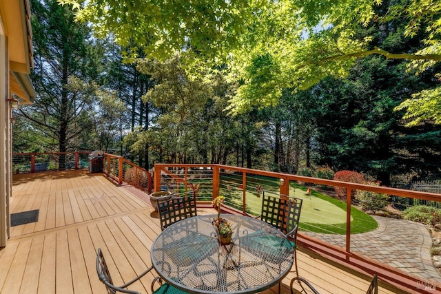 deck featuring outdoor dining area