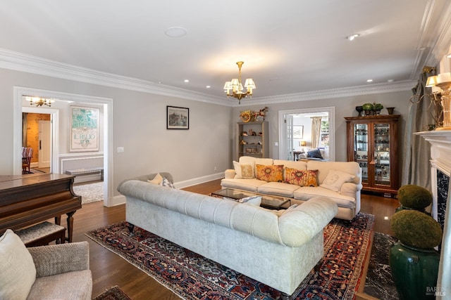 living area featuring an inviting chandelier, crown molding, and a wealth of natural light