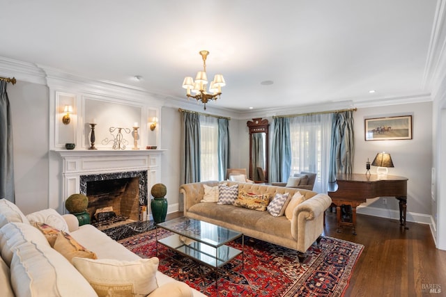 living area with crown molding, an inviting chandelier, and a healthy amount of sunlight