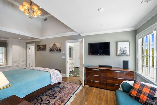 bedroom featuring baseboards, ornamental molding, wood finished floors, and recessed lighting