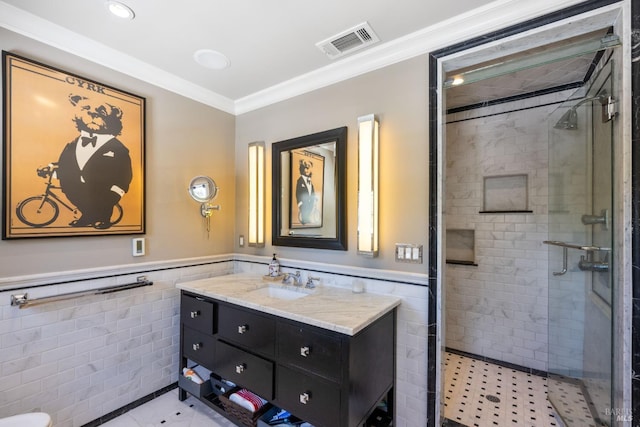 full bathroom with tile walls, tile patterned floors, visible vents, and a shower stall