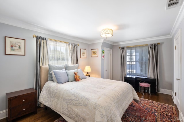 bedroom with visible vents, ornamental molding, dark wood-style flooring, and multiple windows