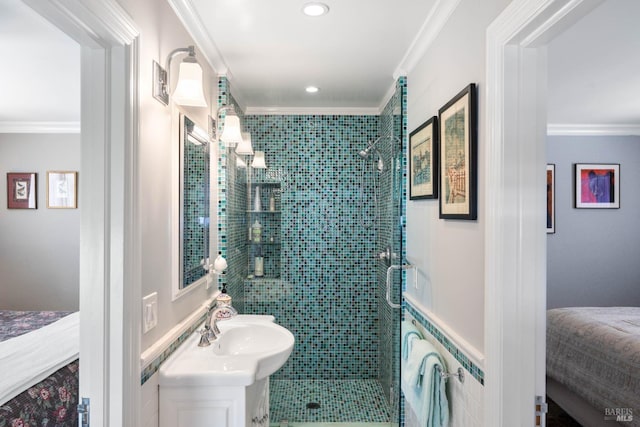 bathroom with vanity, ornamental molding, and a stall shower