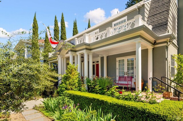 view of front of home featuring a porch and stucco siding