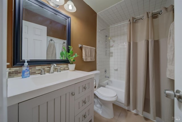 full bathroom featuring toilet, vanity, tasteful backsplash, tile patterned flooring, and shower / bath combination with curtain